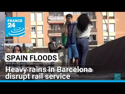 Heavy rains in Barcelona disrupt rail service as troops search for more flood victims in Valencia